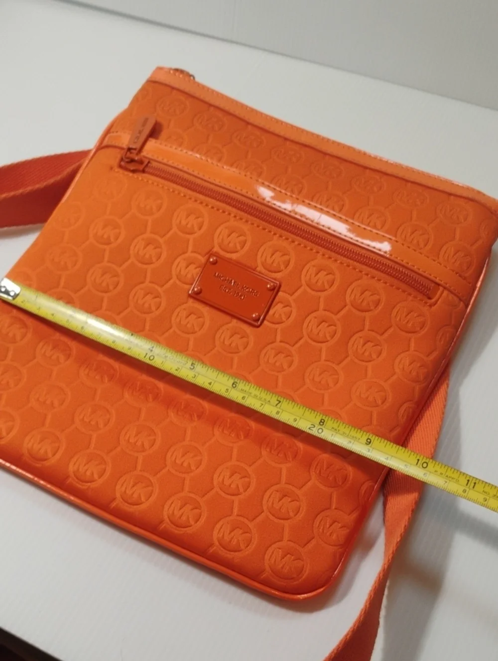 Michael Kors Neoprene Tangerine Mono Embossed Swing Crossbody bag